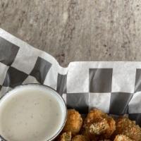 Dill Chips · Thick Cut and hand battered dill pickle chips
golden fried and served with buttermilk-ranch.