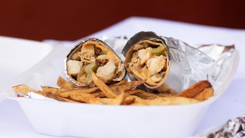 Chicken Wrap · A flour tortilla filled with char-broiled chicken strips, mixed cheese, tomatoes, and lettuce. Served with a side of spicy ranch dressing and tortilla soup.