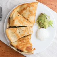 Quesadillas · A large flour tortilla filled with Monterey jack cheese and pico de gallo. Served with guaca...