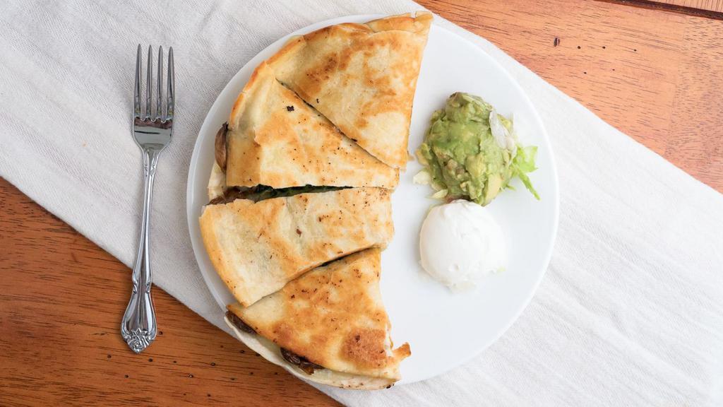 Quesadillas · A large flour tortilla filled with Monterey jack cheese and pico de gallo. Served with guacamole and sour cream.