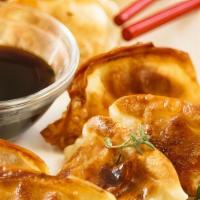 Dumpling · Pork and veggie dumplings. Served with soy sauce.