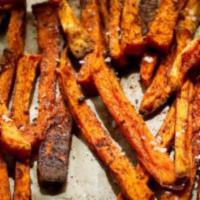 Sweet Potato Fries · House cut sweet potatoes tossed with house seasoning. Served with spicy ketchup and blue che...