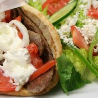 Athenian Greek Gyro · Savory beef and lamb slices rolled in a Greek pita with Fries, feta cheese, lettuce, tomatoe...