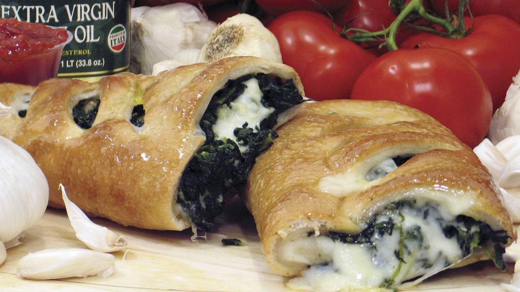 Spinach Stromboli · Traditional hand-rolled fresh dough stuffed with fresh spinach, 100% whole milk mozzarella cheese and lightly
glazed with butter. Fresh oven-baked and served with a side of house-made and award-winning Famous Famiglia marinara sauce.