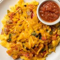Tex-Mex Migas With Salsa Roja · With layers of fluffy scrambled eggs, savory turkey sausage, baked corn tortillas, colorful ...