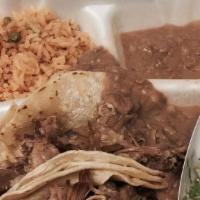Taco Plate · 2 tacos, choice of meat served w/ beans & rice & can drink