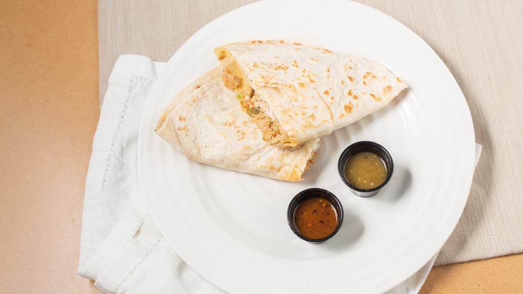 Quesadilla · 10 in tortilla folded in half w/ melted cheese & choice of meat, lettuce, tomato & sour cream.