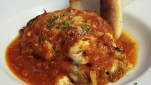 Lasagna · Made with seasoned beef, Italian sausage, and three kinds of cheese.