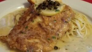 Chicken Francese · Pan-seared in a white wine lemon butter sauce. Served with spaghetti.