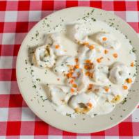 Tortellini · Spinach and sausage filled pasta with Alfredo sauce.