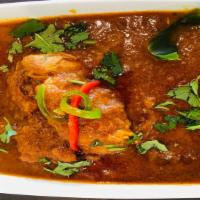 Chicken Curry · Cooked with fresh spices, ginger, garlic, onions & tomatoes