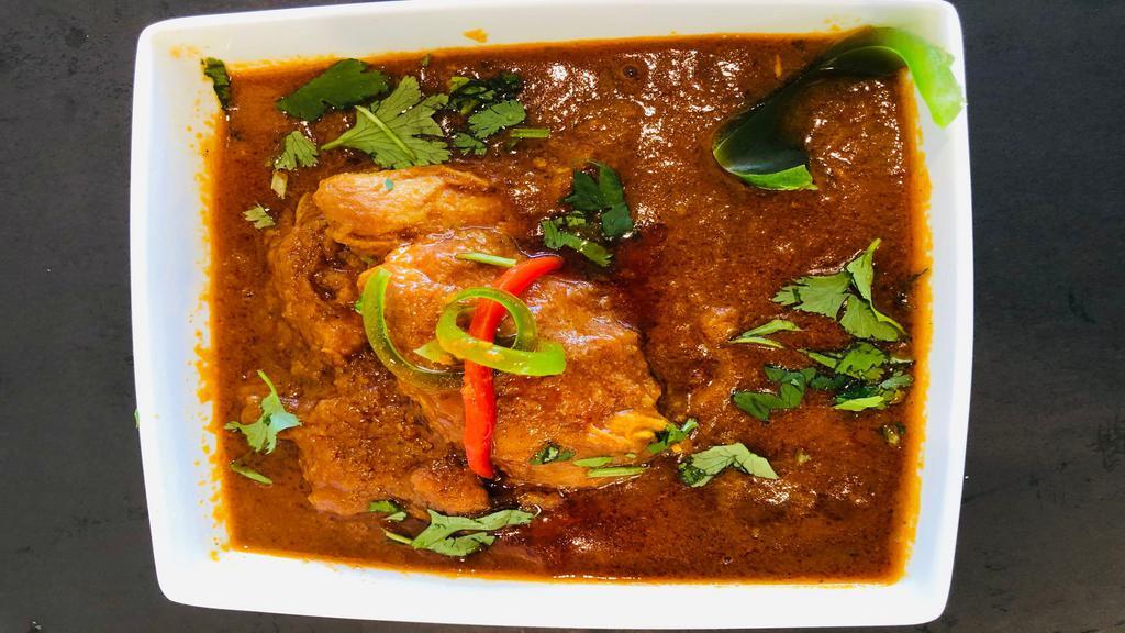 Chicken Curry · Cooked with fresh spices, ginger, garlic, onions & tomatoes