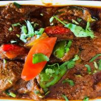 Lamb Curry · Cooked with fresh Indian spices, garlic & ginger paste