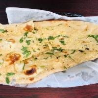 Garlic Naan · White bread baked in tandoor and topped in garlic