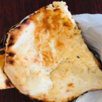 Cheese Naan · White bread stuffed with cheese and baked in tandoor oven