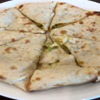 Aaloo Paratha · White bread stuffed with potato and baked in tandoor oven