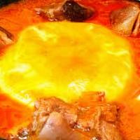 Fufu And Soup · Made from cassava and plantain, served with light soup or groundnut soup.