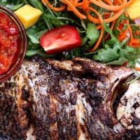 Grilled Tilapia · Well seasoned tilapia and sauteed onions bell peppers