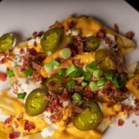 Friezz In Me Crazy · French fries topped with queso jalapeno ranch sauce bacon bits jalapeno slices and chives. w...