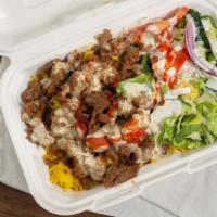 Lamb Gyro And Rice · Rice - Gyro lam Meat - Greens and Signature White sauce