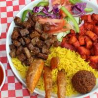 Manhattan Style Rice Bowl · Gyro chicken, gyro meat, saffron rice, falafel, crispy potato, pita bread, fresh greens, sig...