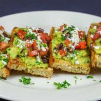 Greek Avocado Toast · Avocado, tomatoes, cucumber and feta cheese on our homemade Tuscan bread.