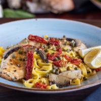 Chicken Piccata · Lightly floured and sautéed chicken with portobello mushrooms, capers and sundried tomatoes ...