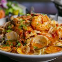 Pasta Di Mare · Fresh shrimp, mussels, clams and calamari swirled together in a spicy Pinot Grigio marinara ...