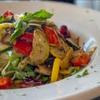 Vegan Veggie Pasta · Zucchini, yellow squash, mushrooms, fresh spinach, roasted red peppers, and fresh Italian he...