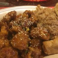  Sesame Chicken · Served with egg roll fried rice and crab rangoon.