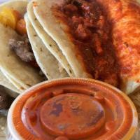 Taco Plate · Incluye arroz, frijoles y 3 tacos 
Elegir su carne