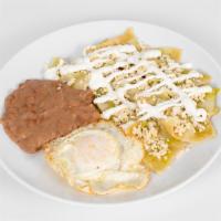 Chilaquiles · Tortilla chips with your choice of salsa roja or verde with cheese, onions, and sour cream. ...