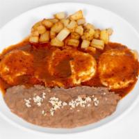 Huevos Rancheros · Sunny side up eggs on corn or flour tortillas topped with salsa roja or verde.  Served with ...