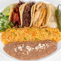 Mi Special · 3 tacos on corn or flour tortilla. Choice of meat served with rice and beans. Grilled onions...