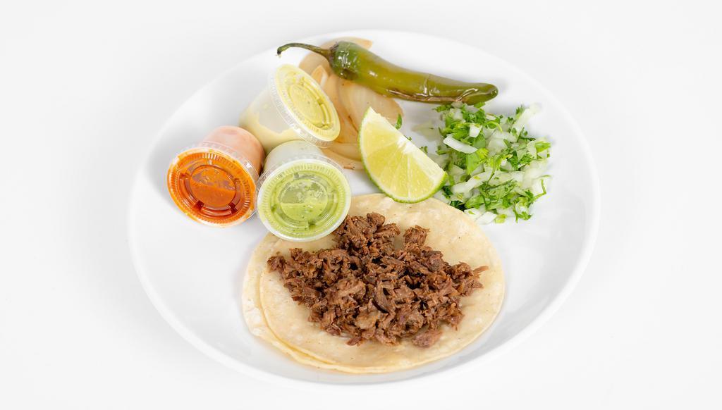 Tacos · Your choice of meat on corn or flour tortilla. Grilled onions, grilled jalapeños, rabanos, lime, cilantro and onion on the side. Choice of red, perrona, or green salsa.