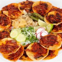 Trompo Special · Trompo (pork) meat on corn tortilla. Grilled onions, grilled jalapeños, rabanos, lime, cilan...