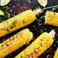 Sweet Chili Corn · Sweet corn tossed with butter, fresh lime, chili powder.