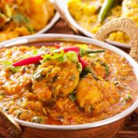 Vegetable Korma  · A stew of assorted veggies simmered in a thick spicy coconut based gravy.
