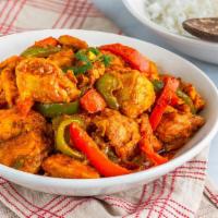 Chicken Jalfrezi · Chicken cooked in tomato sauce, sautéed bell peppers and spices.