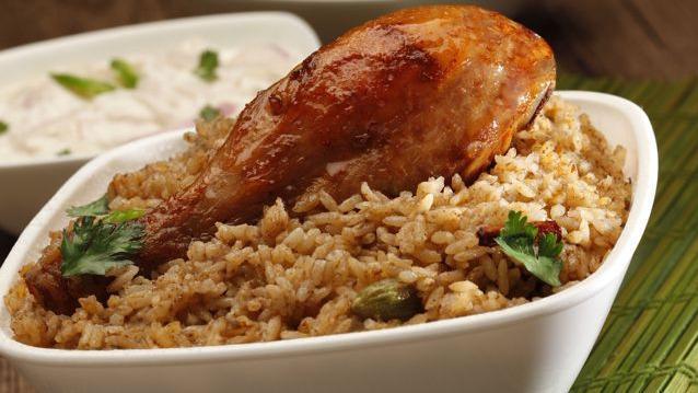 Madurai Chicken Biryani  · chicken marinated in authentic Tamil aromatic spices and cooked with basmati rice.