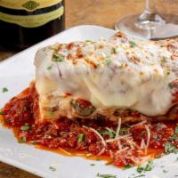 Homemade Baked Lasagna · Meat sauce, mini meatballs and our four Italian cheese blend between layers of homemade past...