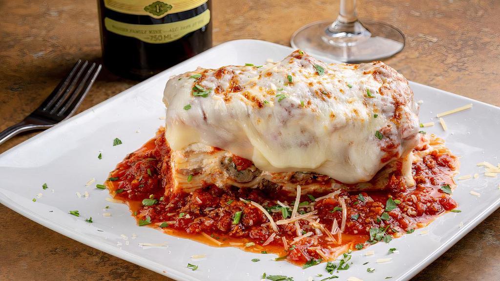 Homemade Baked Lasagna · Meat sauce, mini meatballs and our four Italian cheese blend between layers of homemade pasta. Served with sautéed green beans