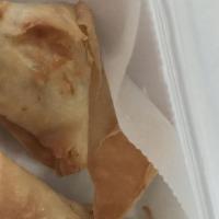 2 Pieces Chicken Samosa · Ground chicken with mixed vegetable, spicy seasoning and wrapped in a lightly pastry.