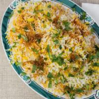 Chicken Biryani · Aged basmati rice mixed with chicken marinated in yogurt and spices, then richly flavored sp...