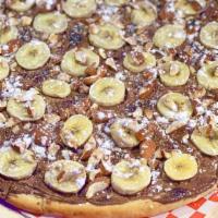 Nutella Pizza · For Hazelnut chocolate spread lovers! Fell the sugar rush with Nutella spread with bananas o...