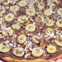 Nutella Pizza · For hazelnut chocolate spread lovers fell the sugar rush with nutella spread with bananas ov...