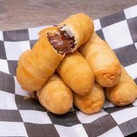 Tequeños Nutella 25 (Nutella Sticks) · Latin American Nutella sticks carefully wrapped in a crispy dough and fried to perfection.