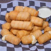 25 Cheese Sticks (Tequeños) · Latin American cheese sticks cheese carefully wrapped in a crispy dough and fried to perfect...