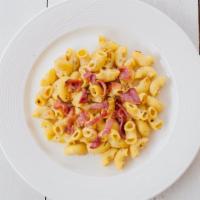 Bacon Mac N Cheese · Our homemade macaroni and cheese topped with crispy bacon.