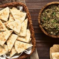 Fresh Pita Chips · Our fresh pita chips are made with fennel oil, parmesan, parsley and citrus.
